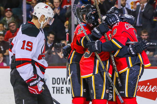 dougie hugging his teammates as he is allowed to be a top four defender once again